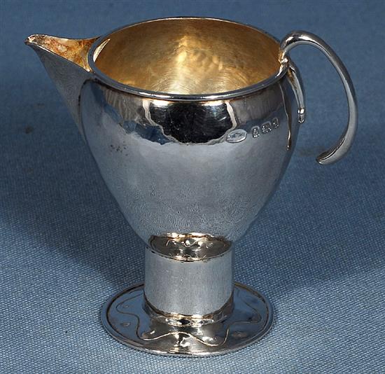 An Edwardian Arts & Crafts silver sparrow beak cream jug, Height 3 ¾”/90mm Weight 2.8oz/80grms